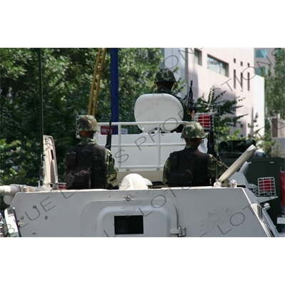 Chinese People's Armed Police Force/PAP (Zhongguo Renmin Wuzhuang Jingcha Budui/Wujing) Officers in an Armoured Personnel Carrier in Urumqi