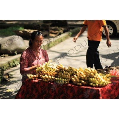 Woman Selling Bananas at a Stall on the side of the Road in Bali