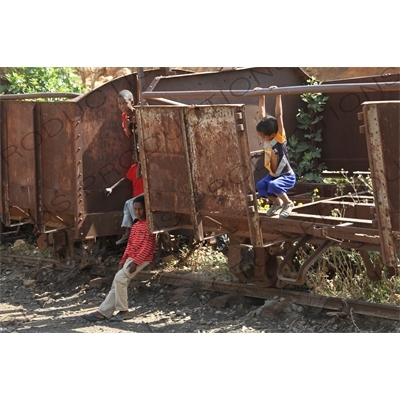 Children Playing on old Railway Cars in a Station along the Asmara to Massawa Railway Line