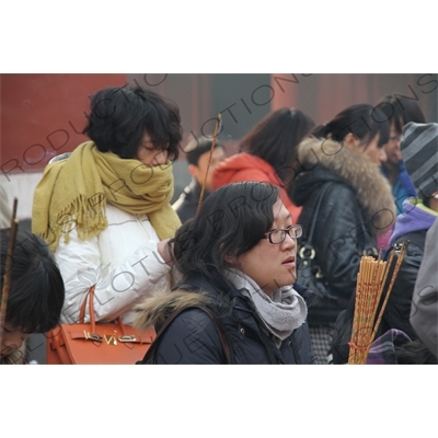 People Burning Incense in the Lama Temple (Yonghegong) in Beijing