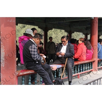 People Playing Cards in the Long Corridor (Chang Lang) in the Temple of Heaven (Tiantan) in Beijing
