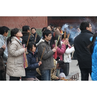 People Burning Incense in the Lama Temple (Yonghegong) in Beijing