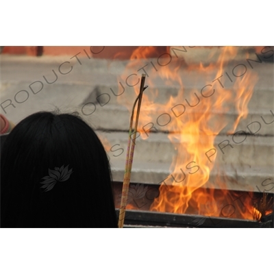 People Burning Incense in the Lama Temple (Yonghegong) in Beijing