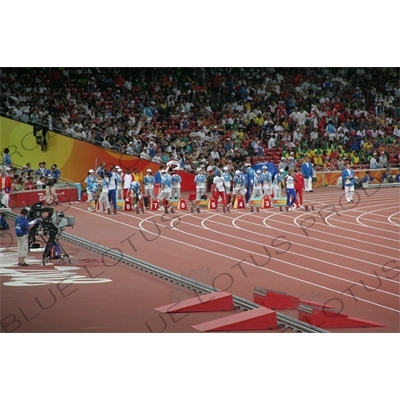 Athletes Lining up for a Men's 100 Metres Heat in the Bird's Nest/National Stadium (Niaochao/Guojia Tiyuchang) in the Olympic Park in Beijing