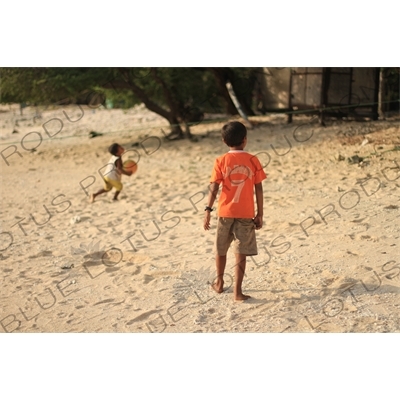 Boys Playing Football on a Beach on Gili Meno