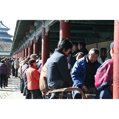 People Playing Games in the Long Corridor (Chang Lang) in the Temple of Heaven (Tiantan) in Beijing