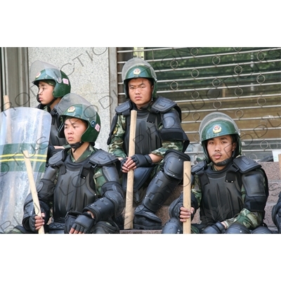 Chinese People's Armed Police Force/PAP (Zhongguo Renmin Wuzhuang Jingcha Budui/Wujing) Officers in Riot Gear on a Street in Urumqi