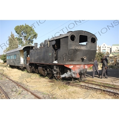 Driver and Engineer Inspecting a Vintage Steam Engine Going from Asmara to Massawa