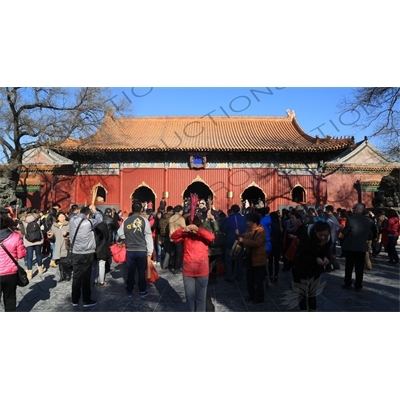 People Burning Incense in front of the Gate of Peace and Harmony (Yonghe Men) in the Lama Temple in Beijing