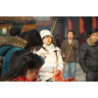 People Burning Incense in the Lama Temple (Yonghegong) in Beijing