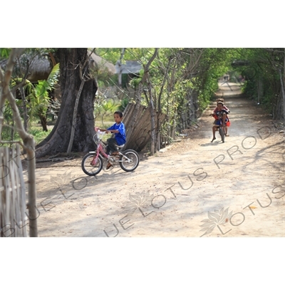 Children Cycling on Gili Meno