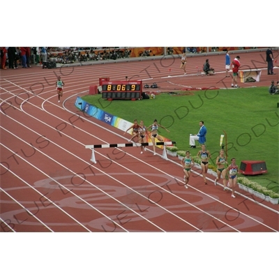 Athlete Jumping Barrier in a Women's 3,000 Metre Steeplechase Heat in the Bird's Nest/National Stadium (Niaochao/Guojia Tiyuchang) in the Olympic Park in Beijing