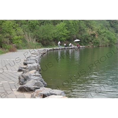 People Fishing in the Reservoir of the Huanghua Cheng Section of the Great Wall of China (Wanli Changcheng) near Beijing