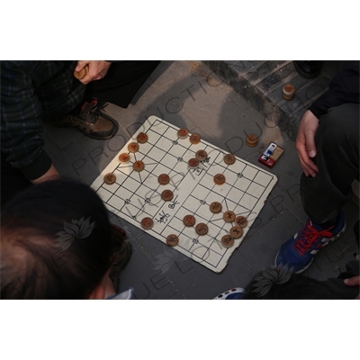 People Playing Chinese Chess near the Long Corridor (Chang Lang) in the Temple of Heaven (Tiantan) in Beijing