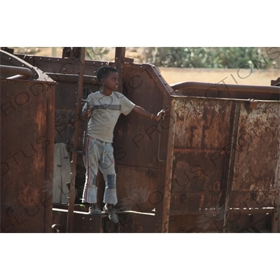 Child Playing on an Old Railway Car in a Station along the Asmara to Massawa Railway Line