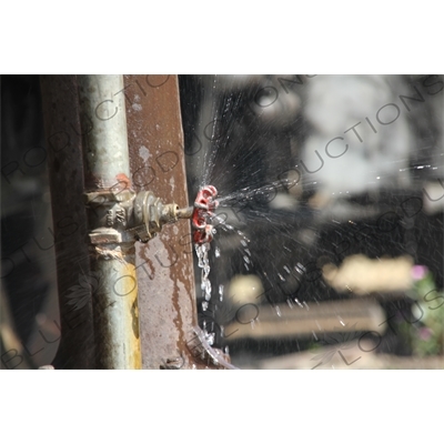 Water Being Expelled from a Pipe on a Vintage Steam Engine Going from Asmara to Massawa