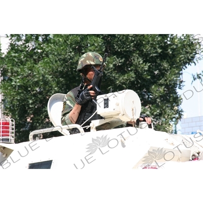 Chinese People's Armed Police Force/PAP (Zhongguo Renmin Wuzhuang Jingcha Budui/Wujing) Officer in an Armoured Personnel Carrier in Urumqi