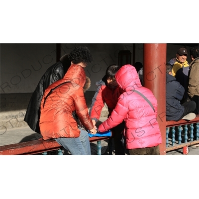 People Playing Cards in the Long Corridor (Chang Lang) in the Temple of Heaven (Tiantan) in Beijing