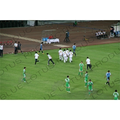 Injured Player During Chinese Super League Match between Beijing Guoan and Dalian Shide at the Workers' Stadium (Gongren Tiyuchang) in Beijing