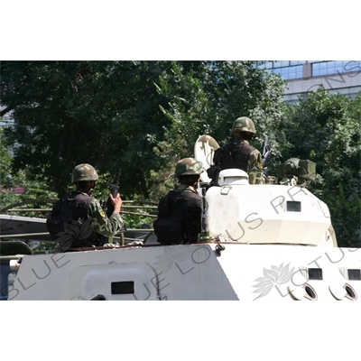 Chinese People's Armed Police Force/PAP (Zhongguo Renmin Wuzhuang Jingcha Budui/Wujing) Officers in an Armoured Personnel Carrier in Urumqi