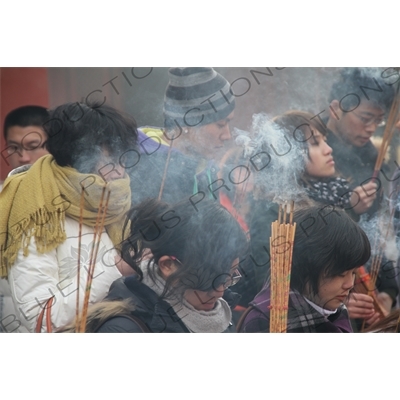 People Burning Incense in the Lama Temple (Yonghegong) in Beijing