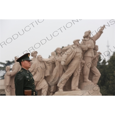 Soldier in front of a 'Heroes of the Revolution' Sculpture outside the Chairman Mao Memorial Hall/Mao's Mausoleum (Mao Zhuxi Jinnian Tang) in Tiananmen Square in Beijing