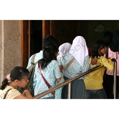 People Queuing to Enter a Building in Jakarta