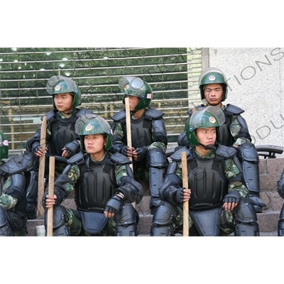 Chinese People's Armed Police Force/PAP (Zhongguo Renmin Wuzhuang Jingcha Budui/Wujing) Officers in Riot Gear on a Street in Urumqi