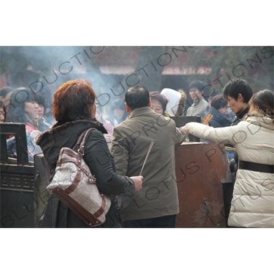 People Burning Incense in the Lama Temple (Yonghegong) in Beijing