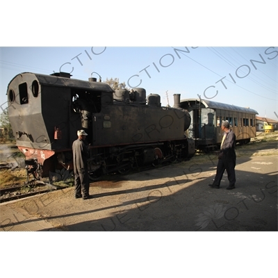 Driver and Engineer Inspecting a Vintage Steam Engine going from Asmara to Massawa