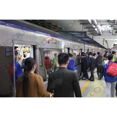 People Boarding a Line 2 Train at Chongwenmen Station in Beijing