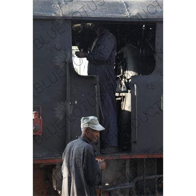 Driver and Engineer Boarding a Vintage Steam Engine going from Asmara to Massawa