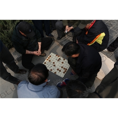 People Playing Chinese Chess near the Long Corridor (Chang Lang) in the Temple of Heaven (Tiantan) in Beijing