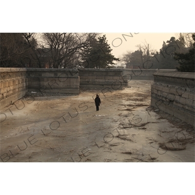 Woman Walking on a Frozen Kunming Lake in the Summer Palace in Beijing