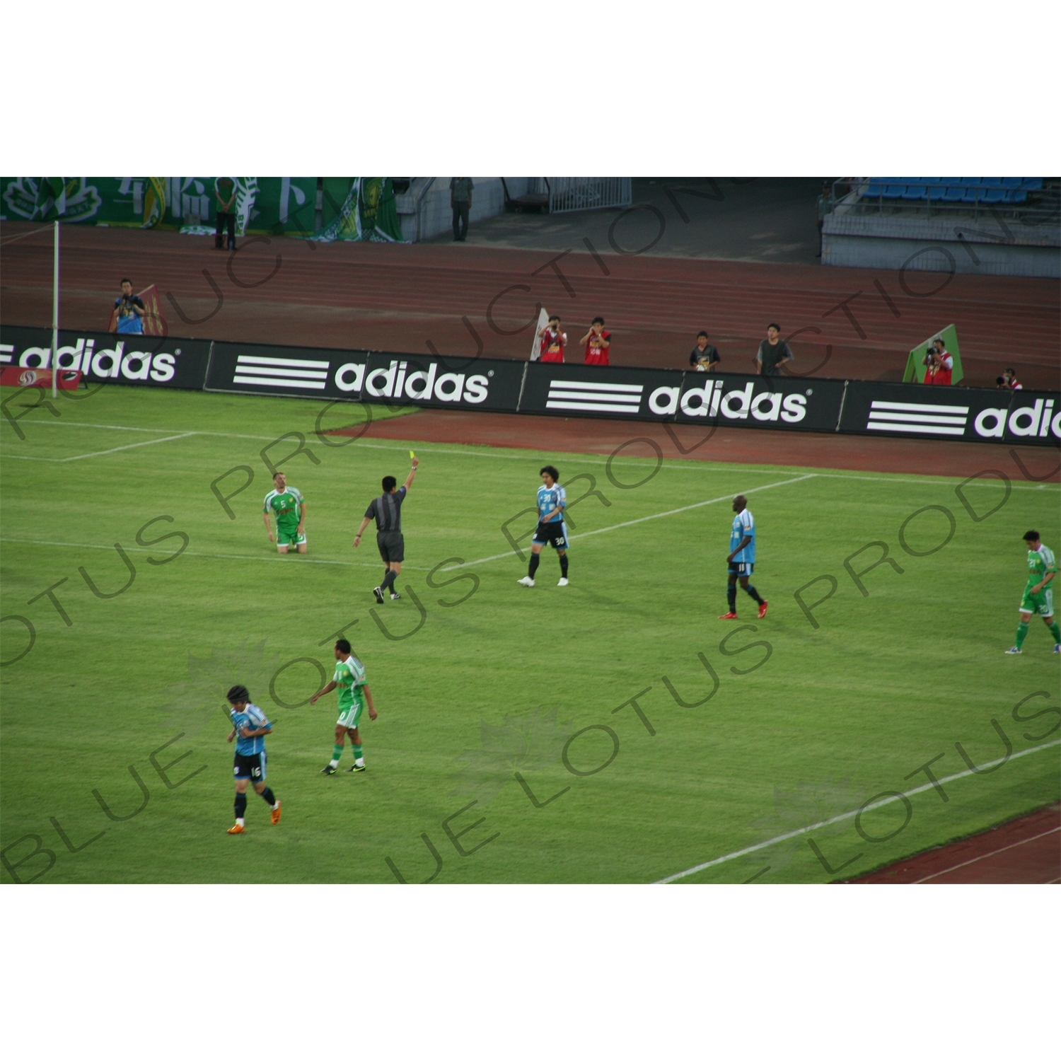 Yellow Card During a Chinese Super League Match between Beijing Guoan and Dalian Shide at the Workers' Stadium (Gongren Tiyuchang) in Beijing