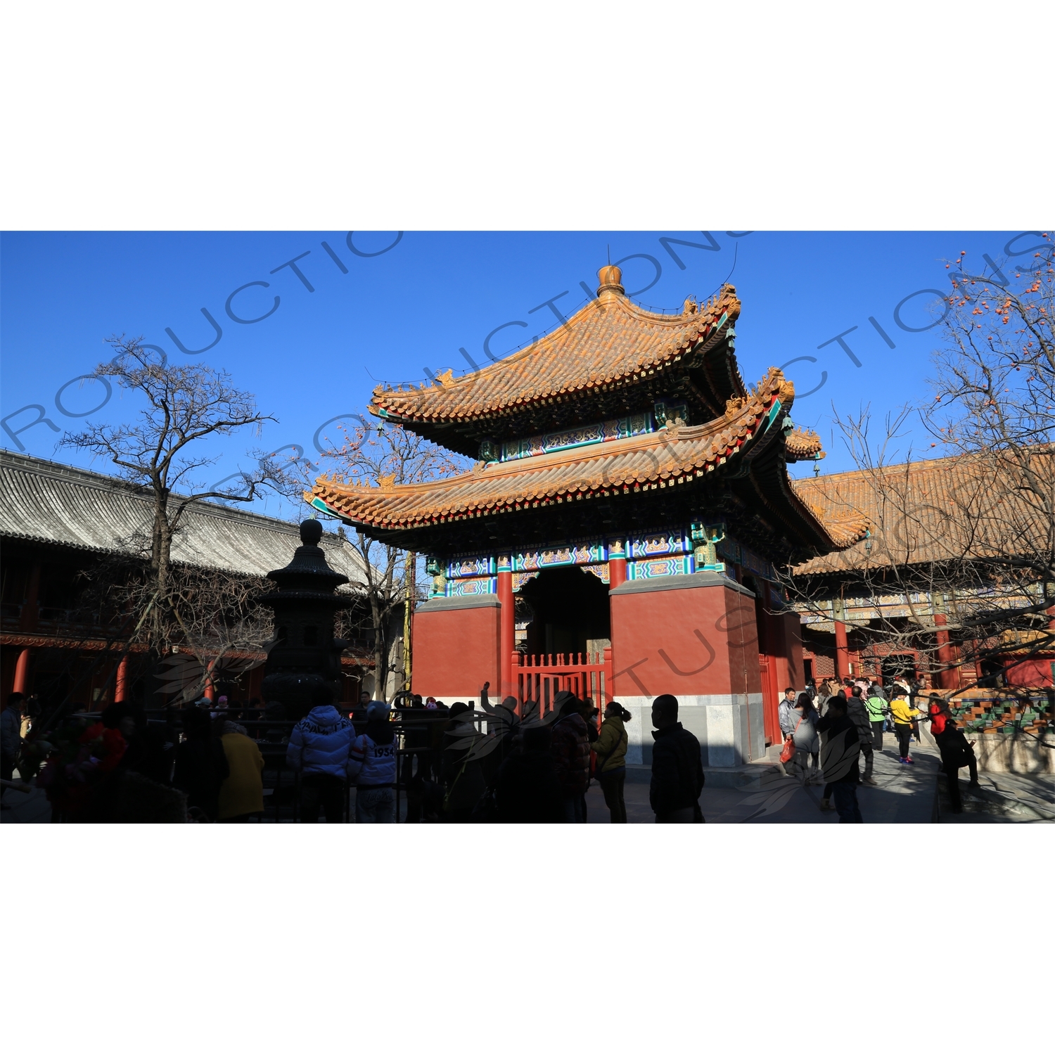 People Throwing Coins at an Incense Burner for Luck in front of the Four Language Stele Pavilion/Imperial Handwriting Pavilion in the Lama Temple in Beijing