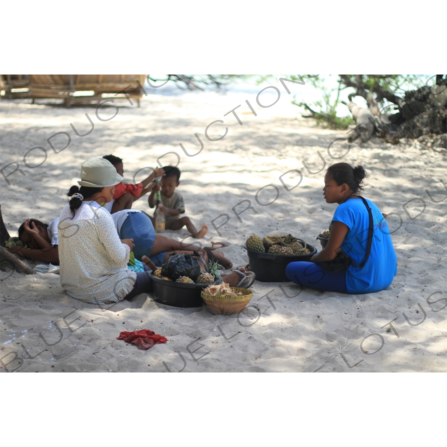 Pineapple Sellers on a Beach on Gili Meno