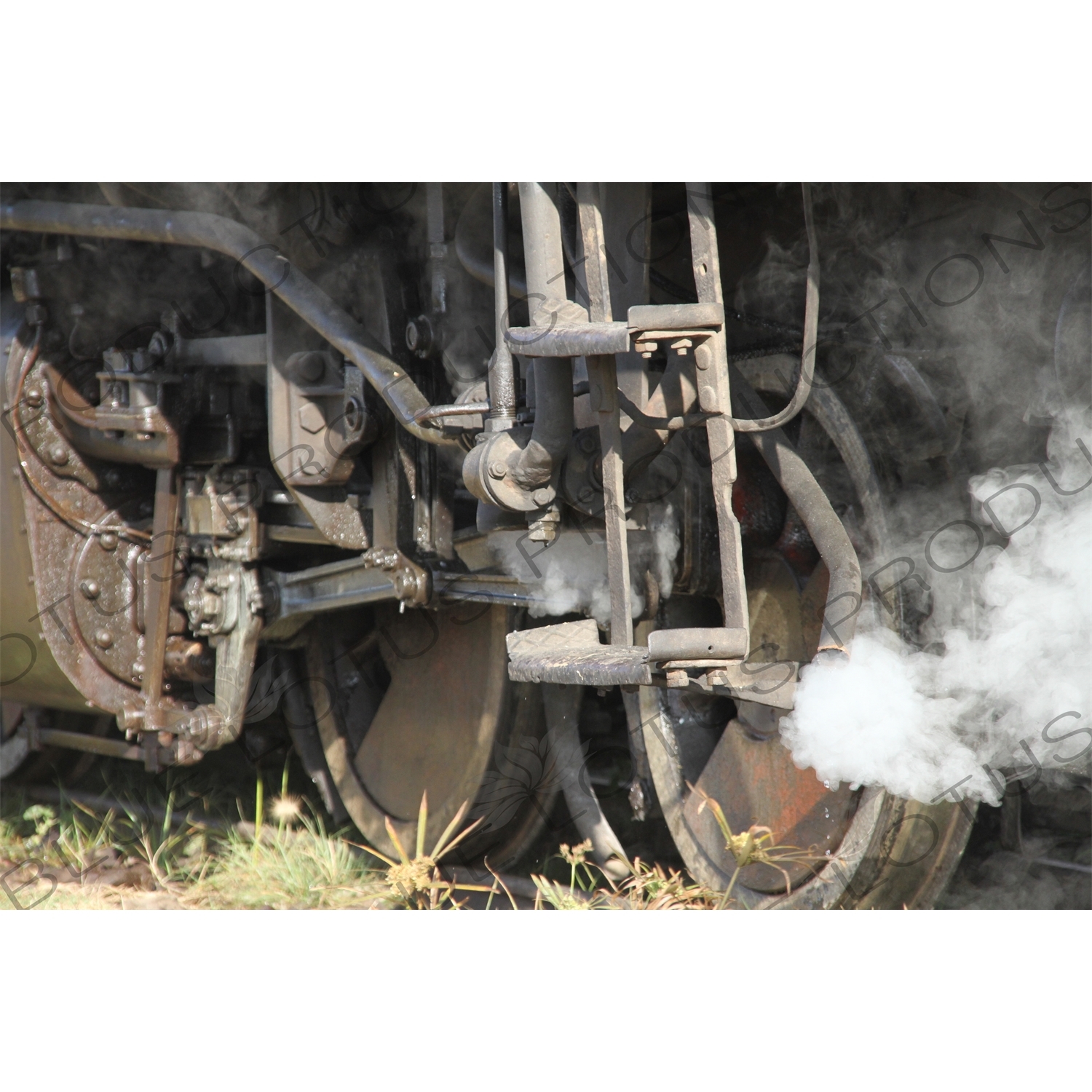 Steam Coming out from behind a Wheel on a Vintage Steam Engine Going from Asmara to Massawa