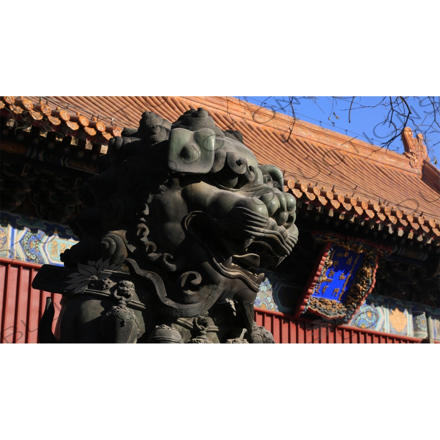 Guardian Lion Statue and the Gate of Peace and Harmony (Yonghe Men) in the Lama Temple in Beijing