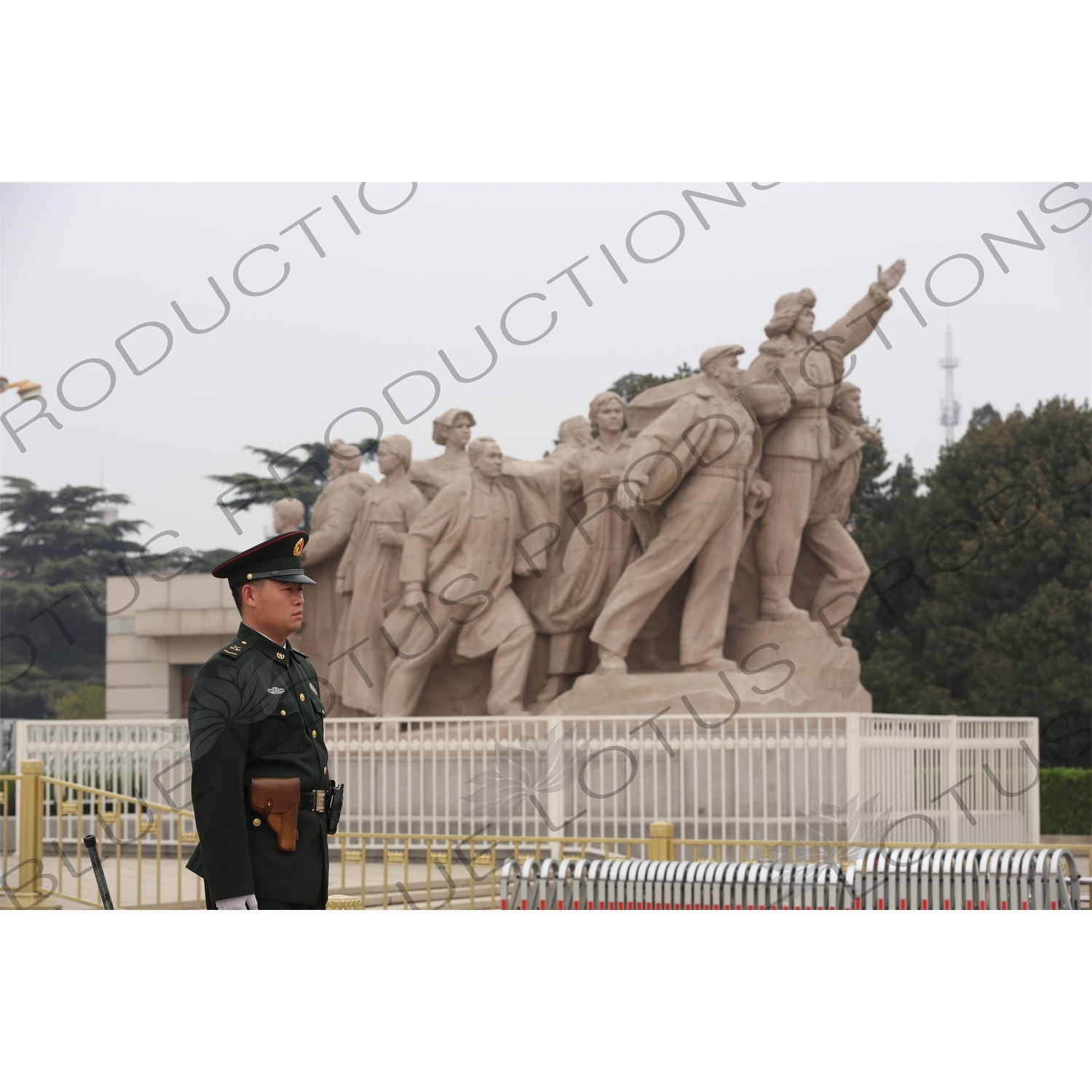 Soldier in front of a 'Heroes of the Revolution' Sculpture outside the Chairman Mao Memorial Hall/Mao's Mausoleum (Mao Zhuxi Jinnian Tang) in Tiananmen Square in Beijing