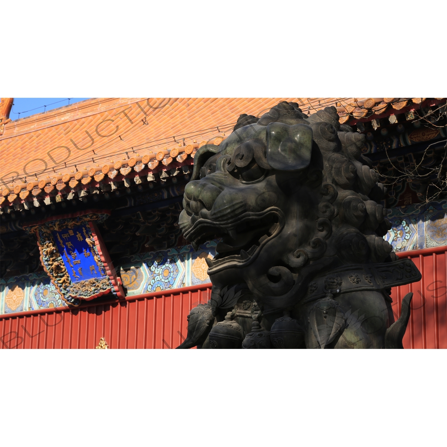 Lion Guardian Statue and Gate of Peace and Harmony (Yonghe Men) in the Lama Temple in Beijing