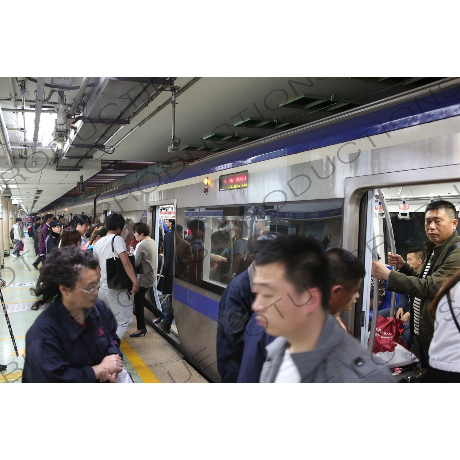 People Boarding a Line 2 Train at Chongwenmen Station in Beijing