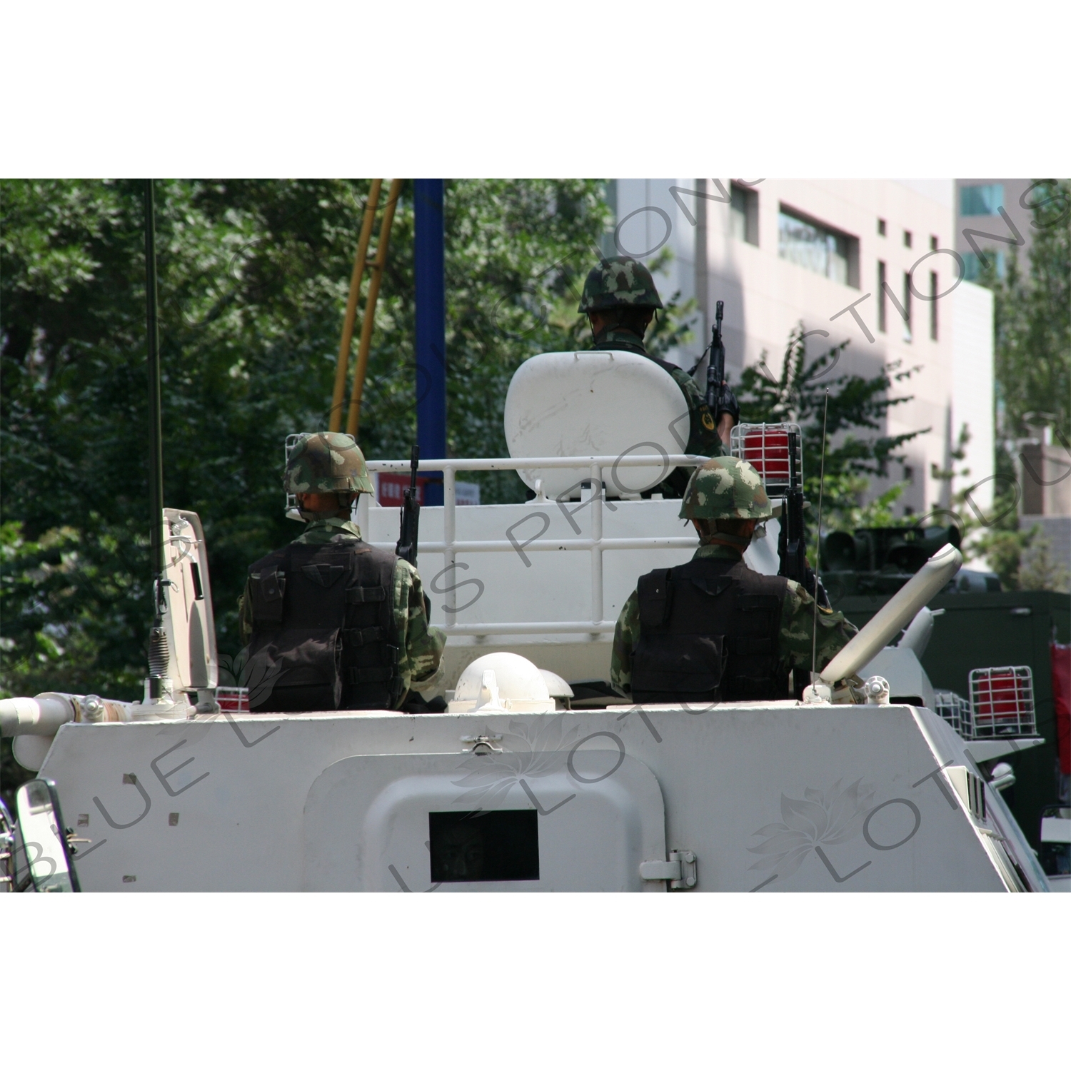 Chinese People's Armed Police Force/PAP (Zhongguo Renmin Wuzhuang Jingcha Budui/Wujing) Officers in an Armoured Personnel Carrier in Urumqi