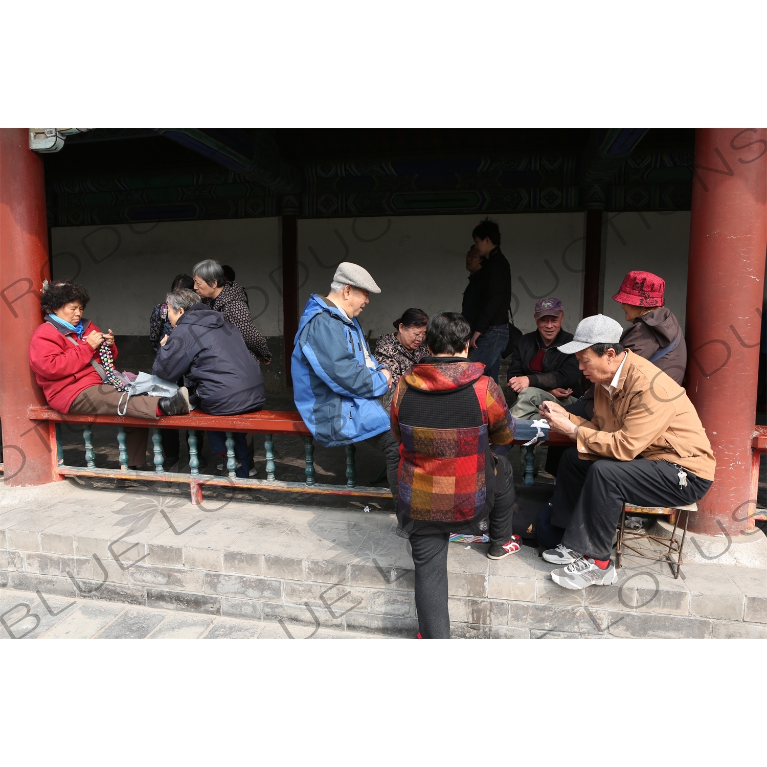 People Knitting and Playing Cards in the Long Corridor (Chang Lang) in the Temple of Heaven (Tiantan) in Beijing