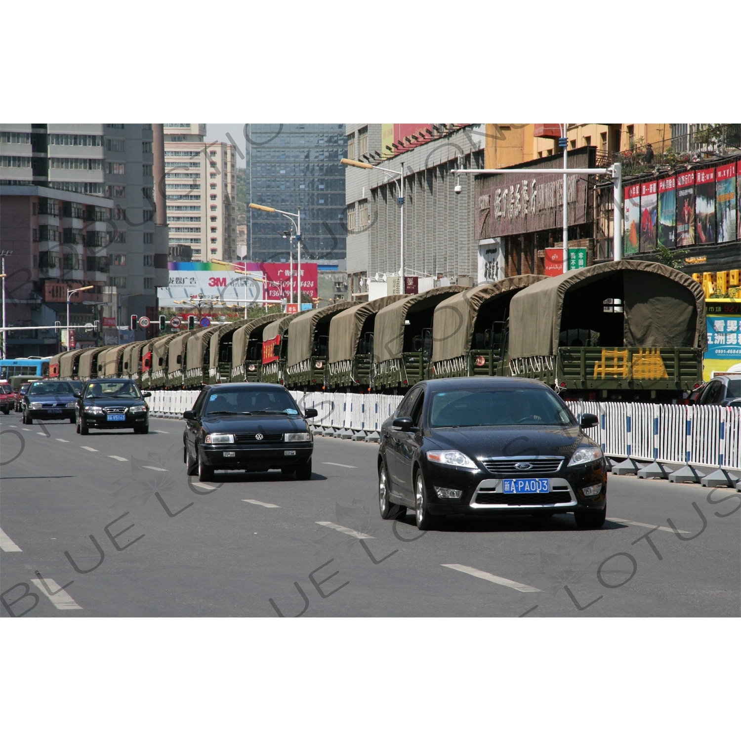 Chinese People's Armed Police Force/PAP (Zhongguo Renmin Wuzhuang Jingcha Budui/Wujing) Personnel Transport Vehicles on a Street in Urumqi