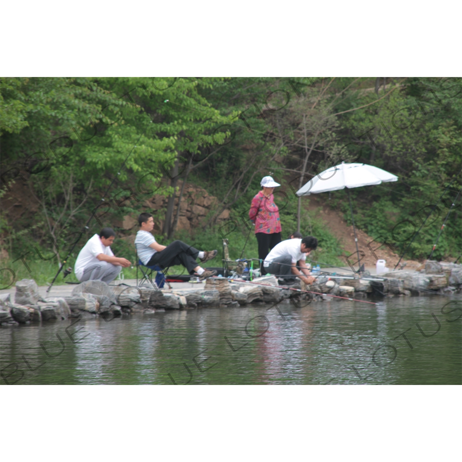 People Fishing in the Reservoir of the Huanghua Cheng Section of the Great Wall of China (Wanli Changcheng) near Beijing