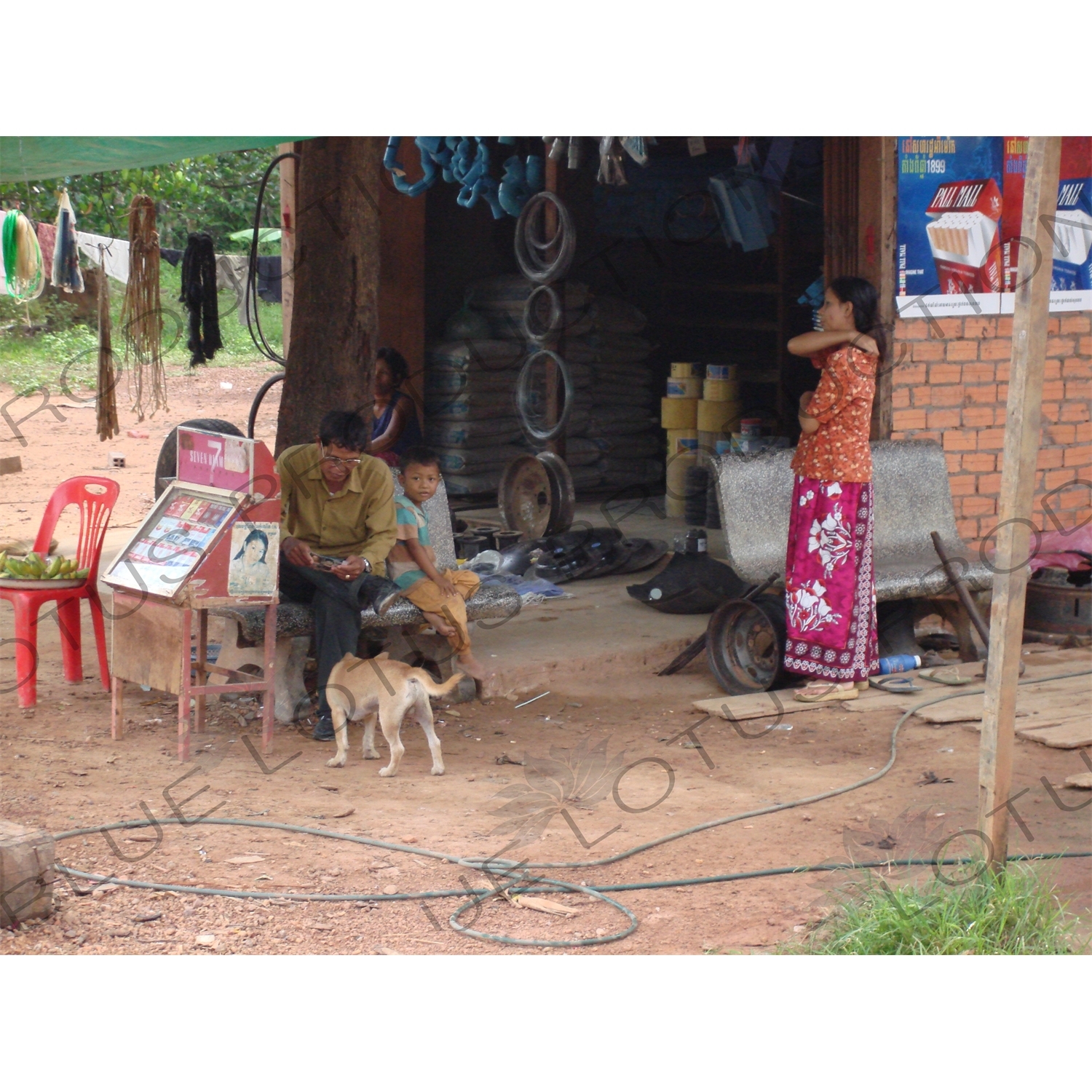 Family Selling Cigarettes by the Roadside in Angkor