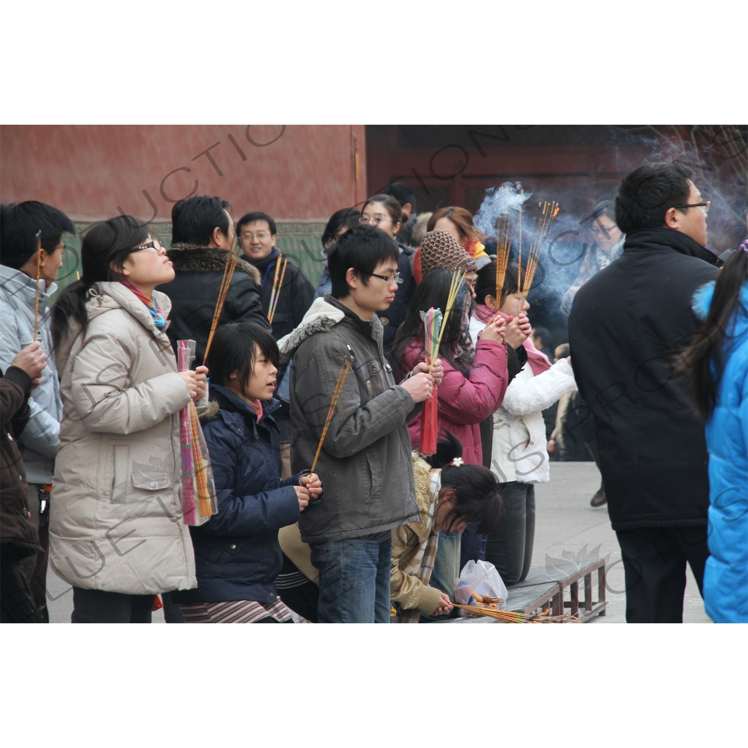 People Burning Incense in the Lama Temple (Yonghegong) in Beijing