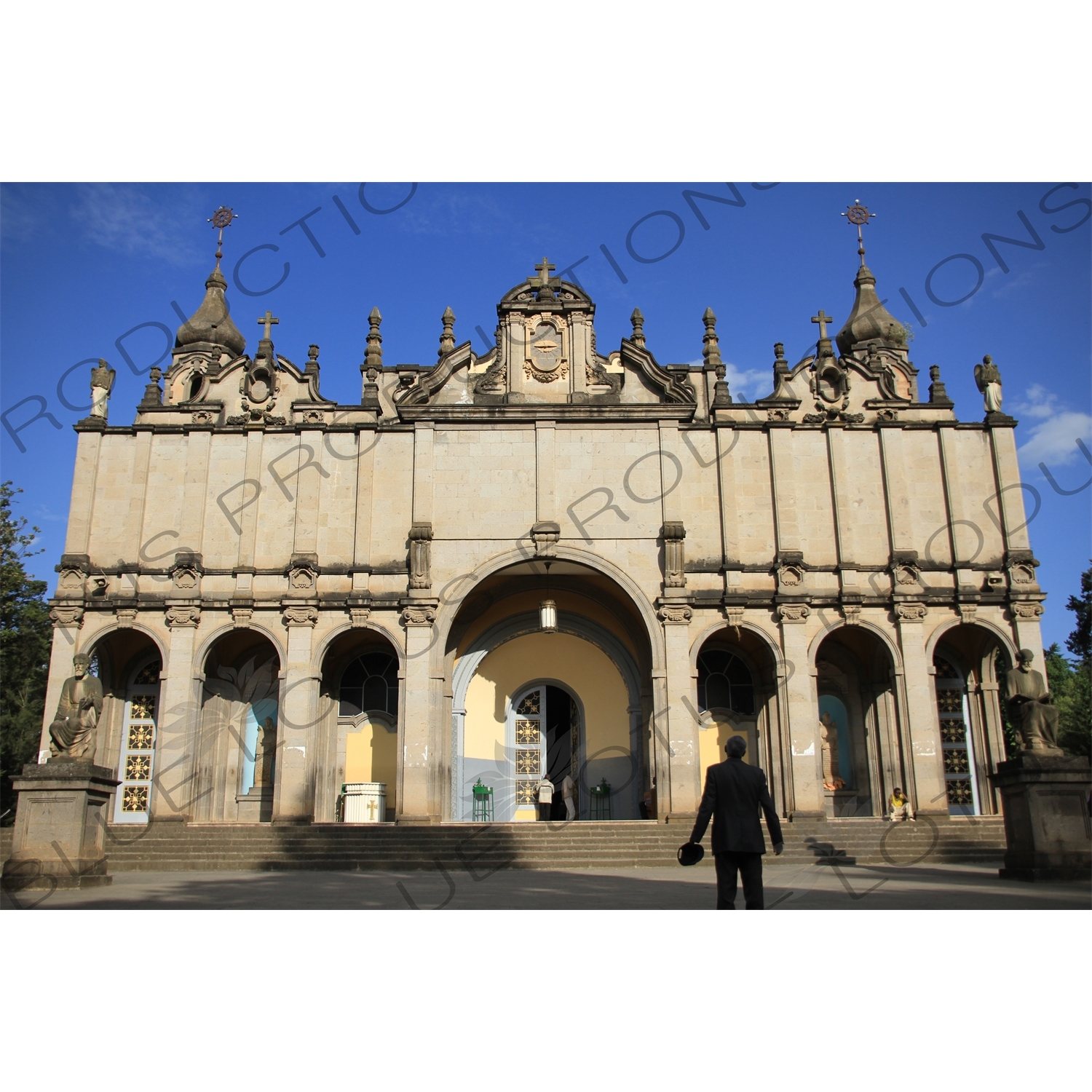 Man Praying in front of Holy Trinity Church (Kidist Selassie) in Addis Ababa