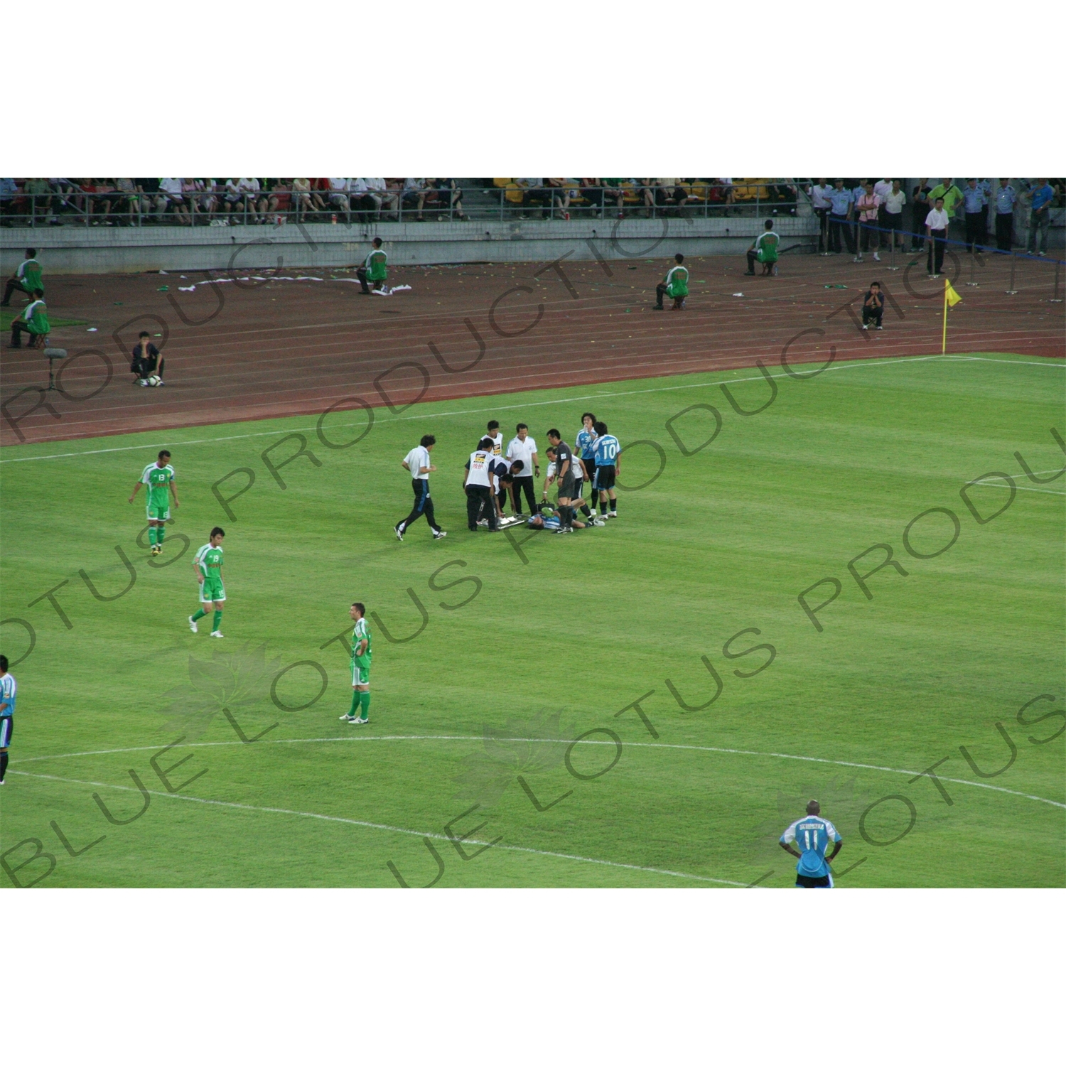 Injured Player During a Chinese Super League Match between Beijing Guoan and Dalian Shide at the Workers' Stadium (Gongren Tiyuchang) in Beijing